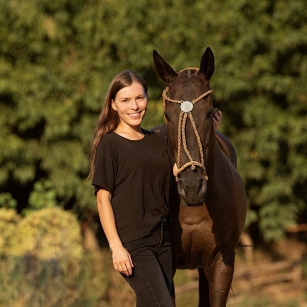 Polina Nazarova with a polo pony